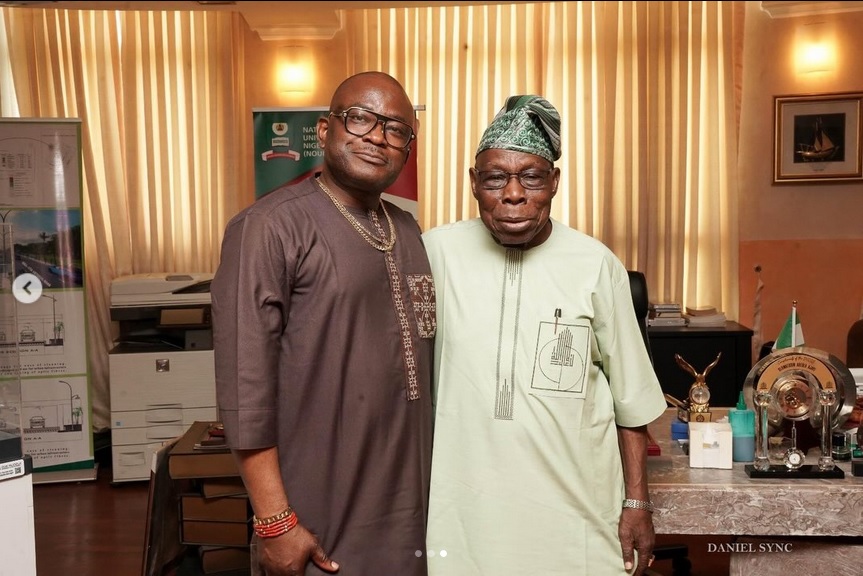 Otunba Jerry Oluranti standing with Former President Olusegun Obasanjo
